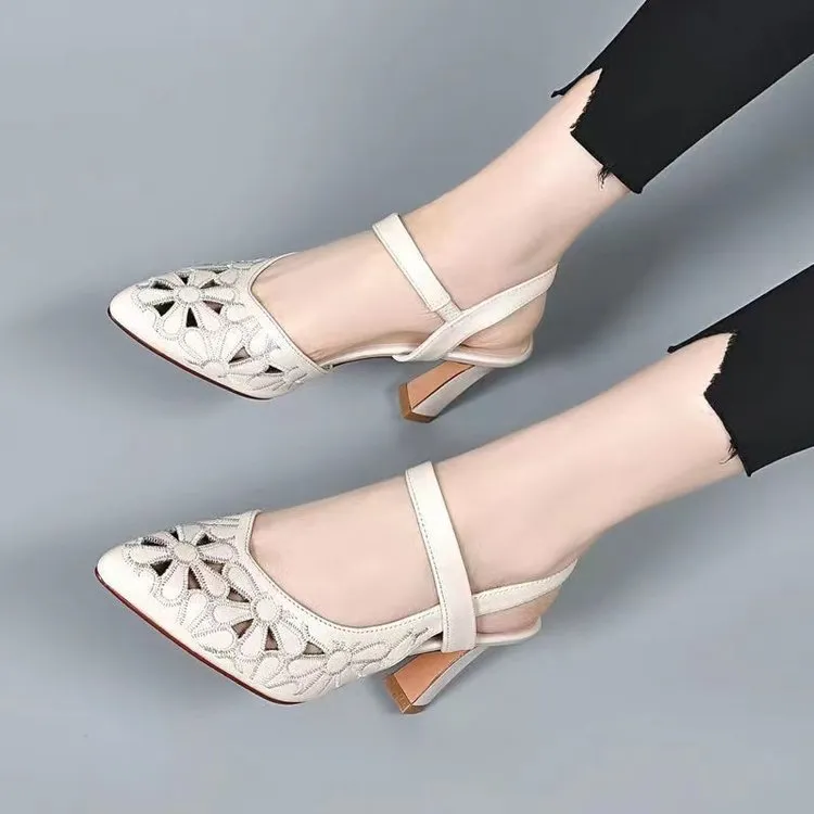 Women's pointed toe sandals with hollowed toe box in black, red, and creamy-white on a rubber sole.