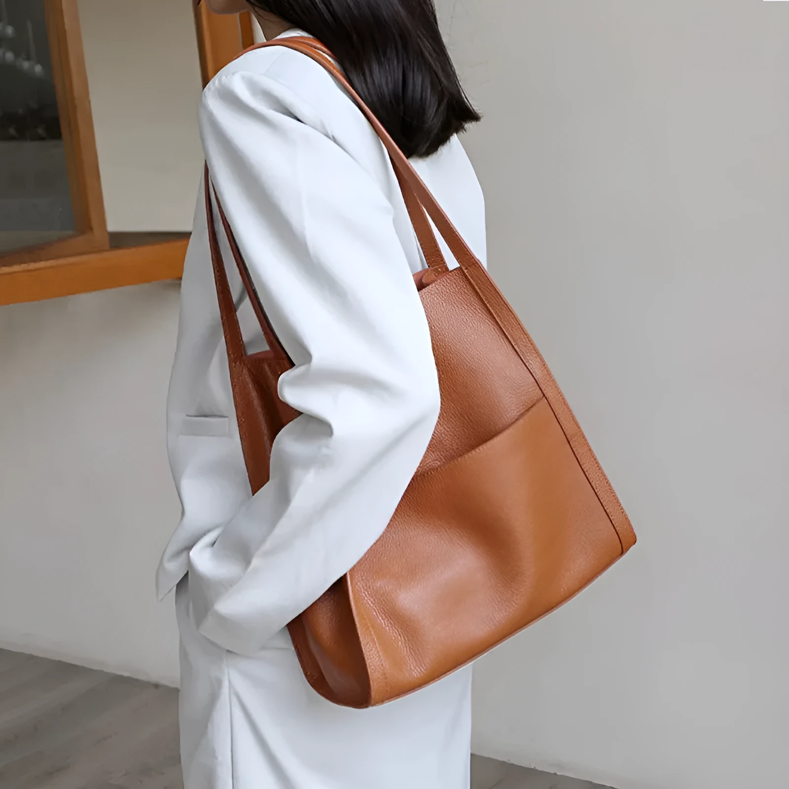 Genuine leather square vertical shoulder bag in black, soft first layer cowhide with sewing thread detail and three-dimensional outer pocket