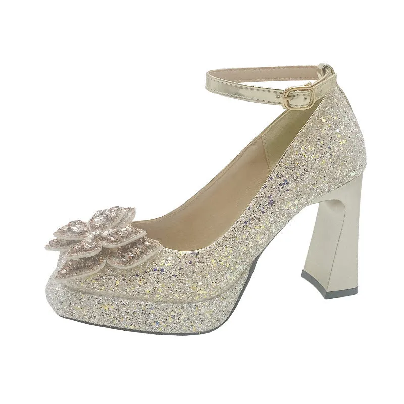 Women's crystal sequined high heels in silver with short stout heel and buckle fastening on a white background