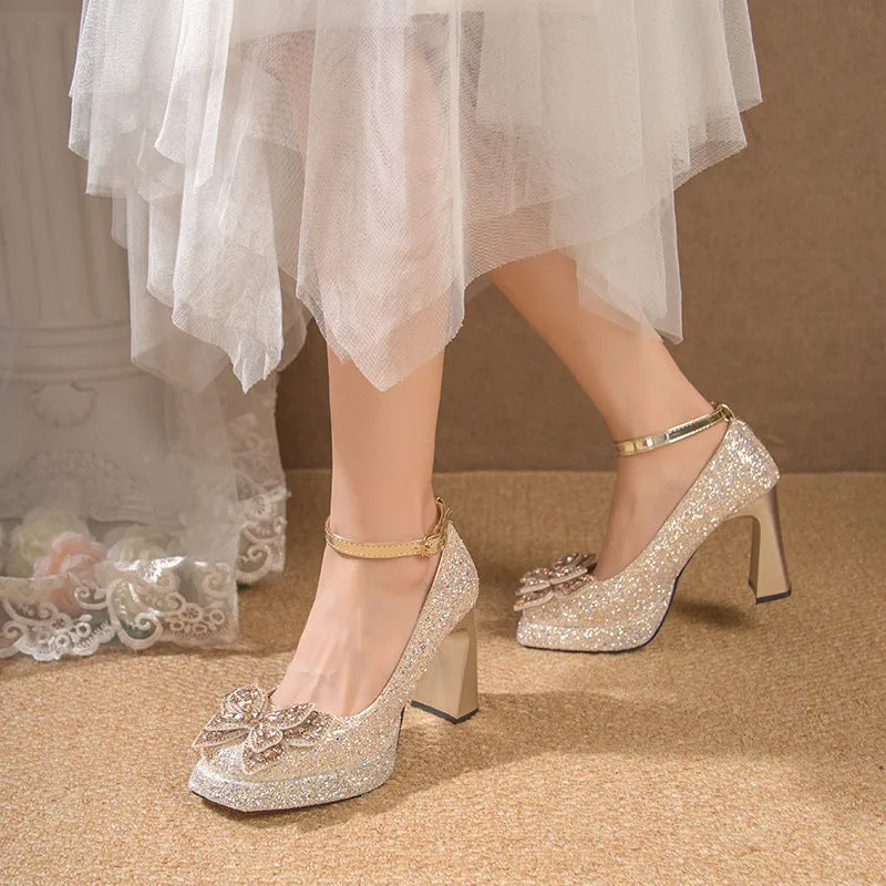 Women's crystal sequined high heels in silver with short stout heel and buckle fastening on a white background