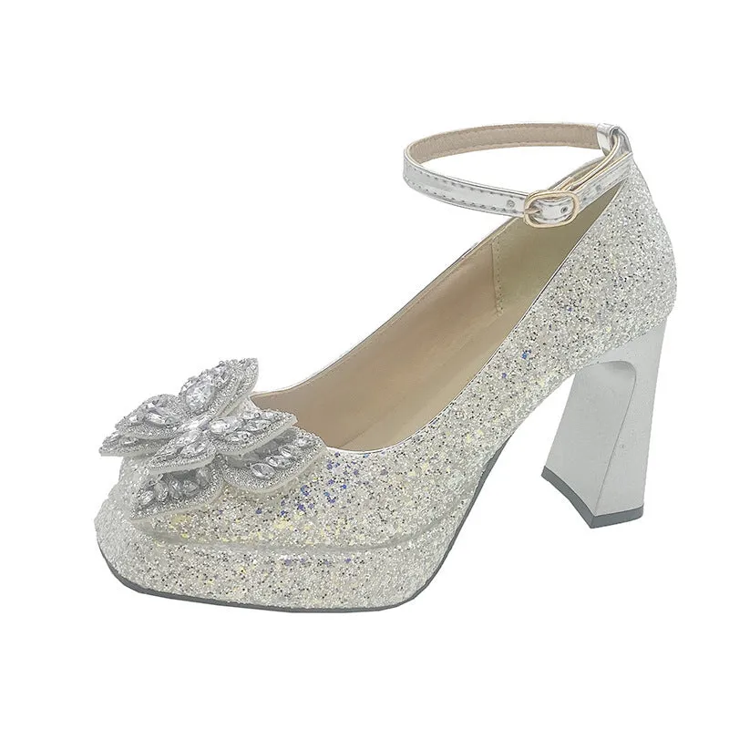 Women's crystal sequined high heels in silver with short stout heel and buckle fastening on a white background