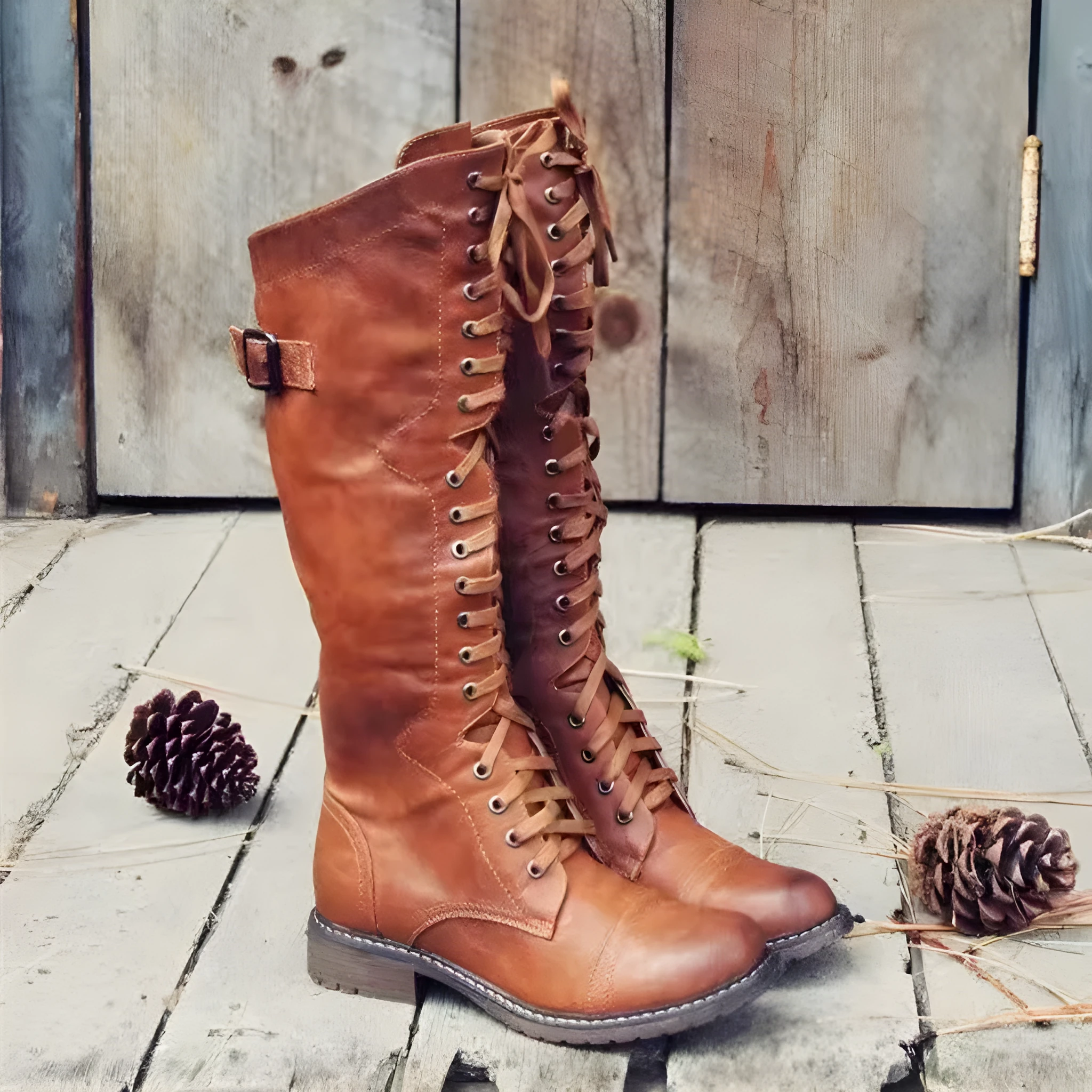 Brown high leg casual boots with a round toe and a chunky low heel on a plain background.