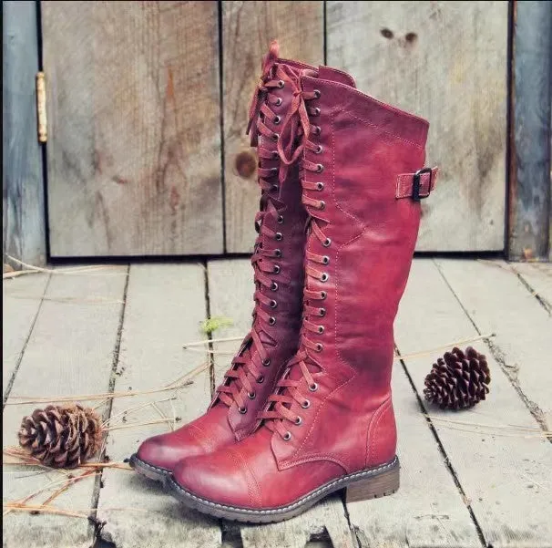Brown high leg casual boots with a round toe and a chunky low heel on a plain background.