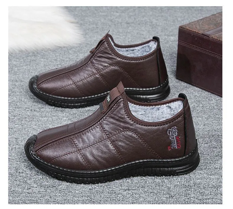 Men's brown winter cotton boots with a buckle closure and a thick, treaded non-slip sole.
