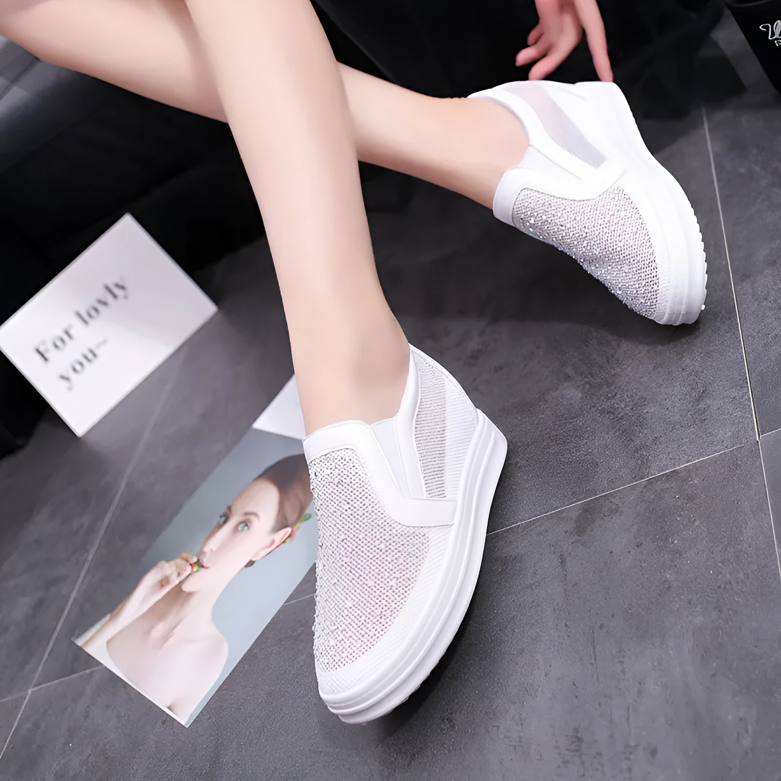 Women's wedge slip-on shoes in black with mesh upper and round toe