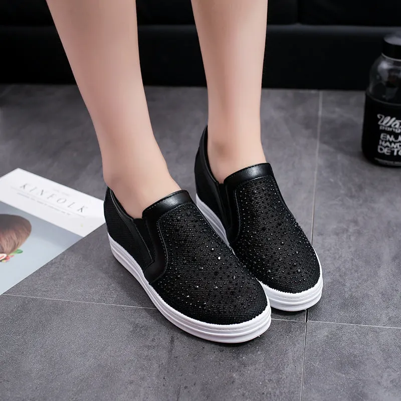 Women's wedge slip-on shoes in black with mesh upper and round toe