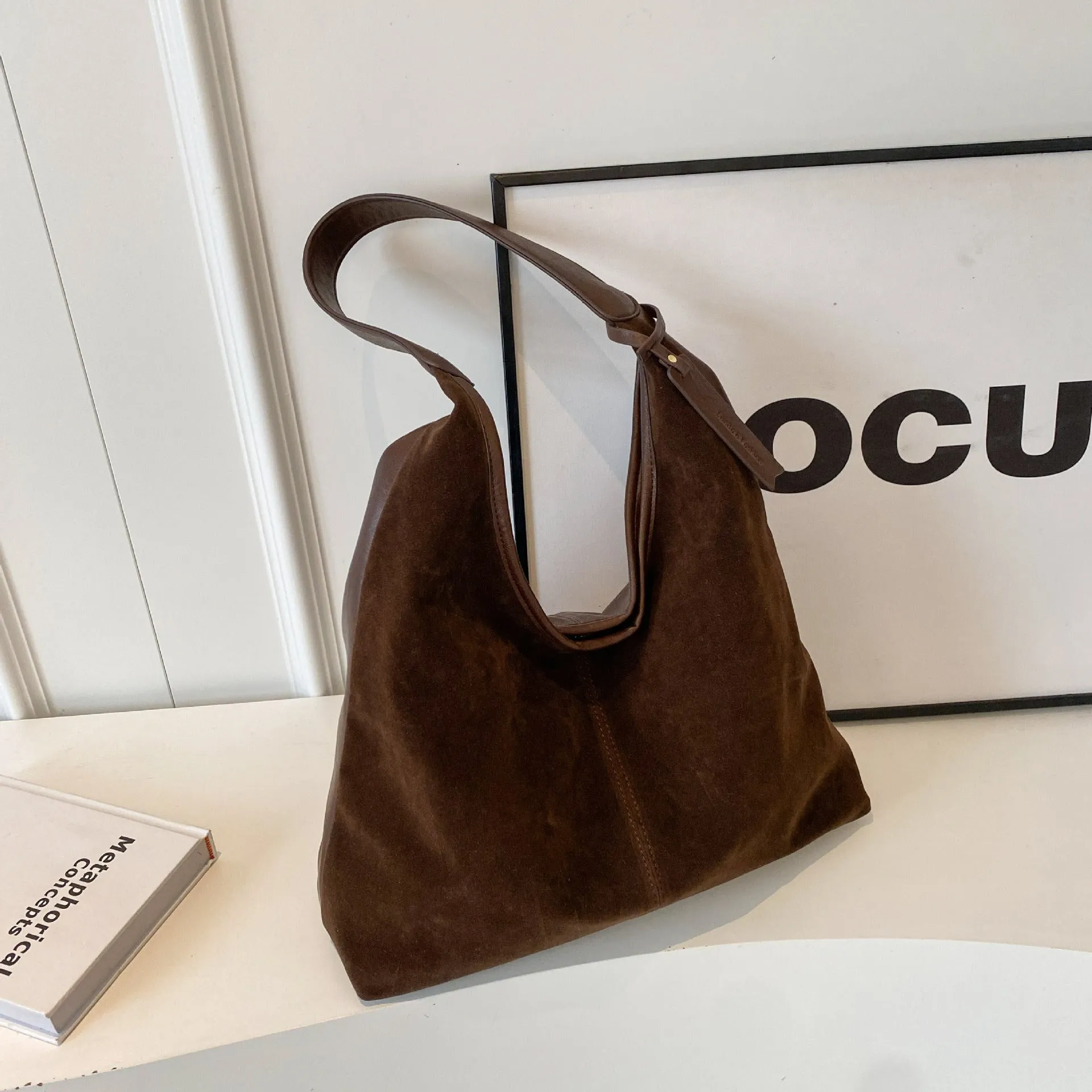 Retro PU shoulder bag with suede stitching and bucket shape in brown colour