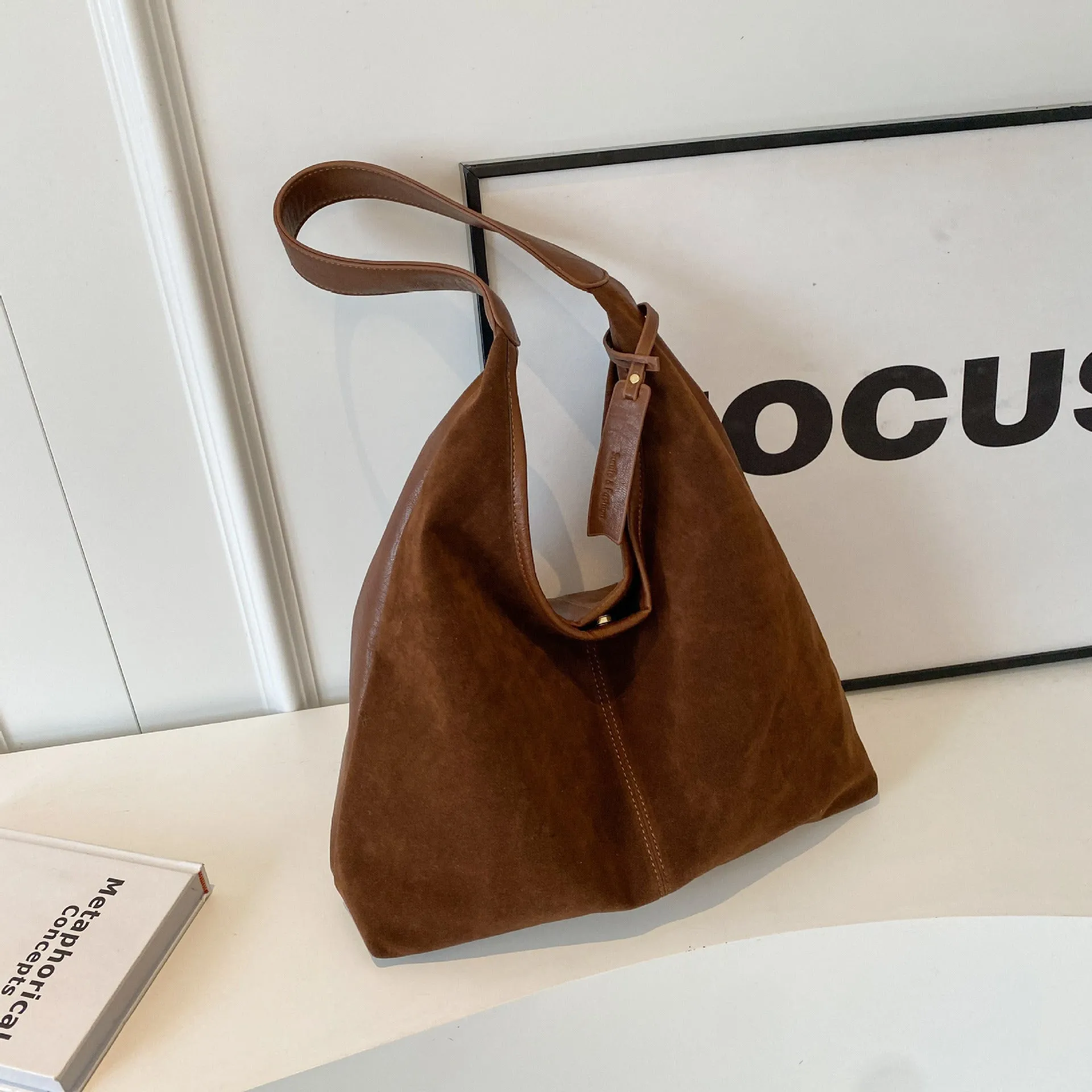 Retro PU shoulder bag with suede stitching and bucket shape in brown colour