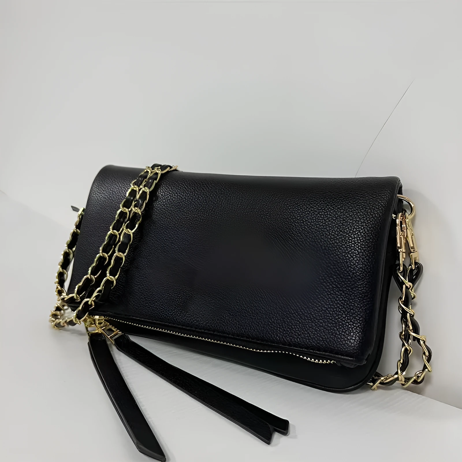 Women's black shoulder messenger bag with chain detailing and organised interior compartments