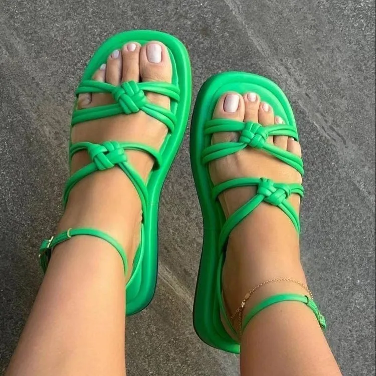 Women's woven beach sandals with PU upper and ankle buckle in five colours including green and rose red