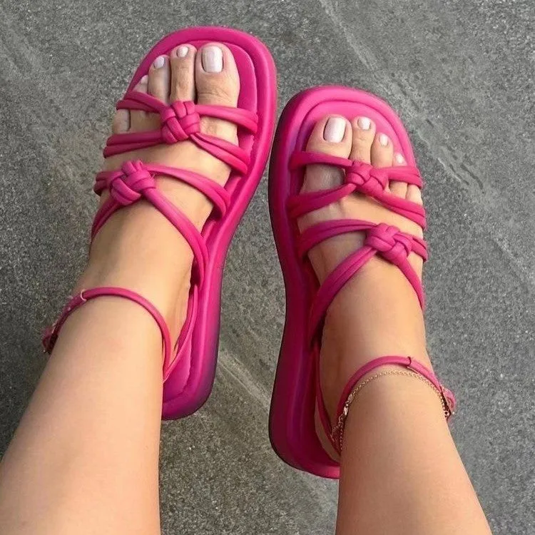 Women's woven beach sandals with PU upper and ankle buckle in five colours including green and rose red