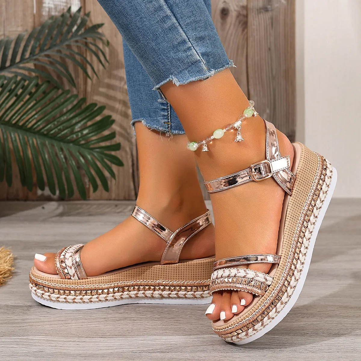 Gold women's wedge sandals with woven texture and round toe design