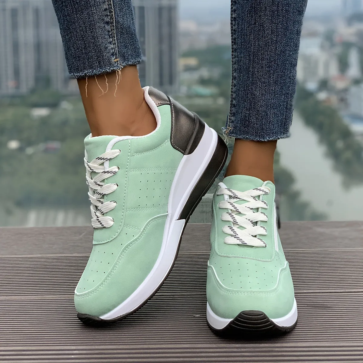 Women's casual sneakers with thick EVA outsole and synthetic leather upper in black, side view
