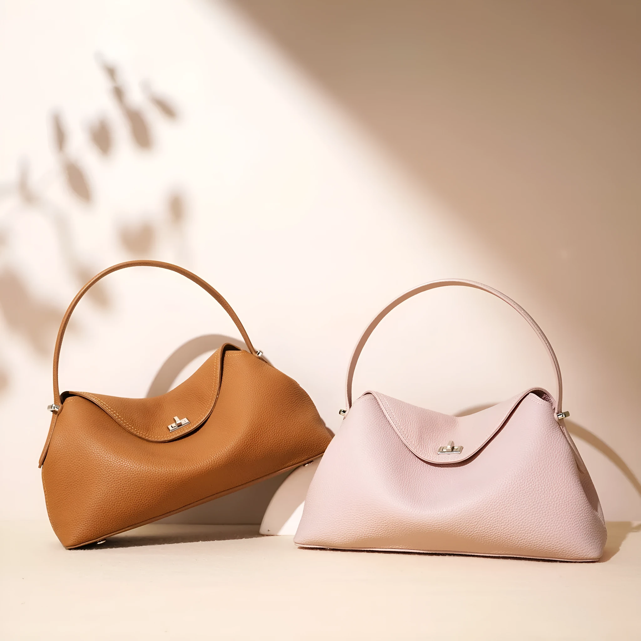 Cowhide leather shoulder messenger bag in pillow shape with open pocket, available in five colours including black and golden brown.
