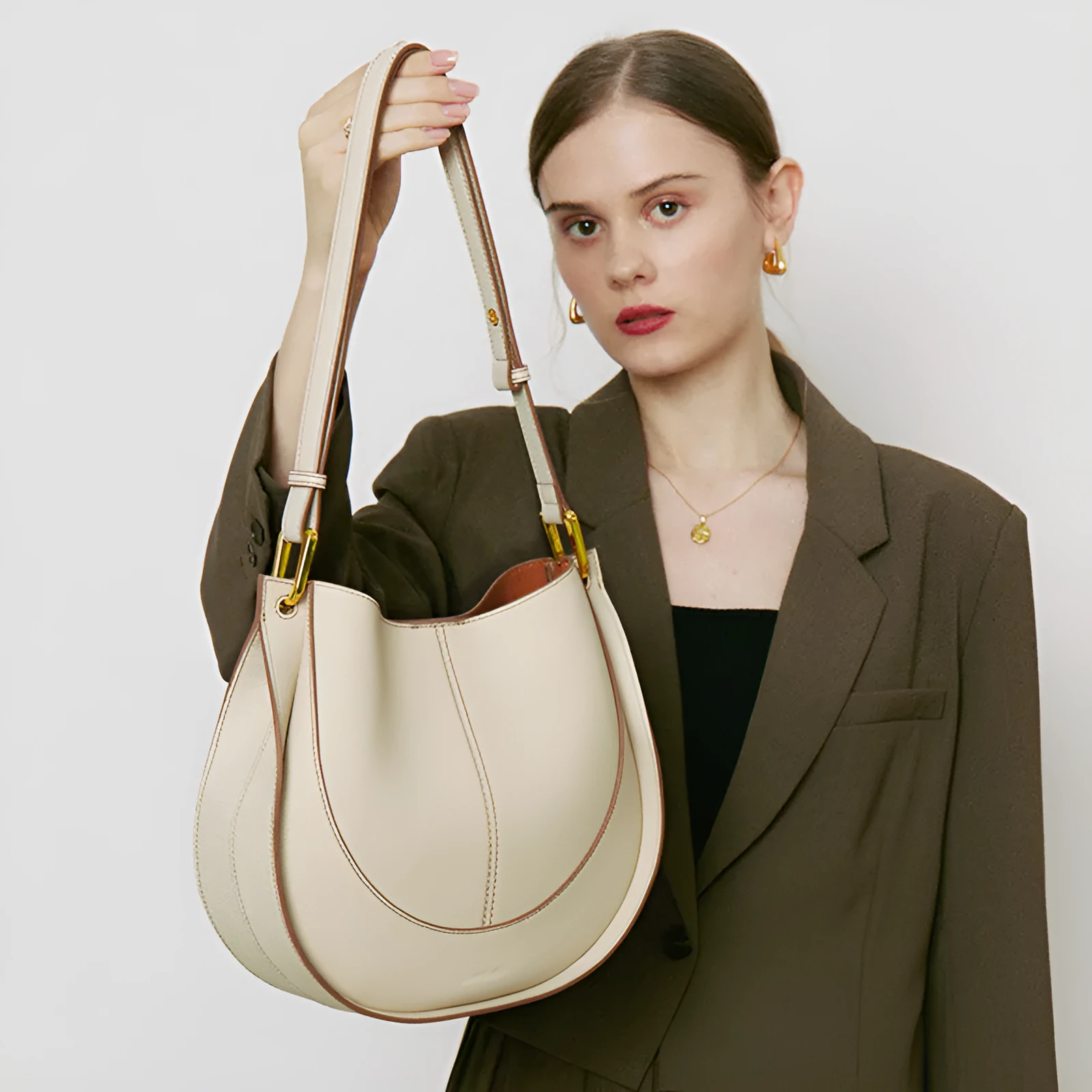 Designer small crossbody bag for women in genuine top grain leather with retro splicing detail