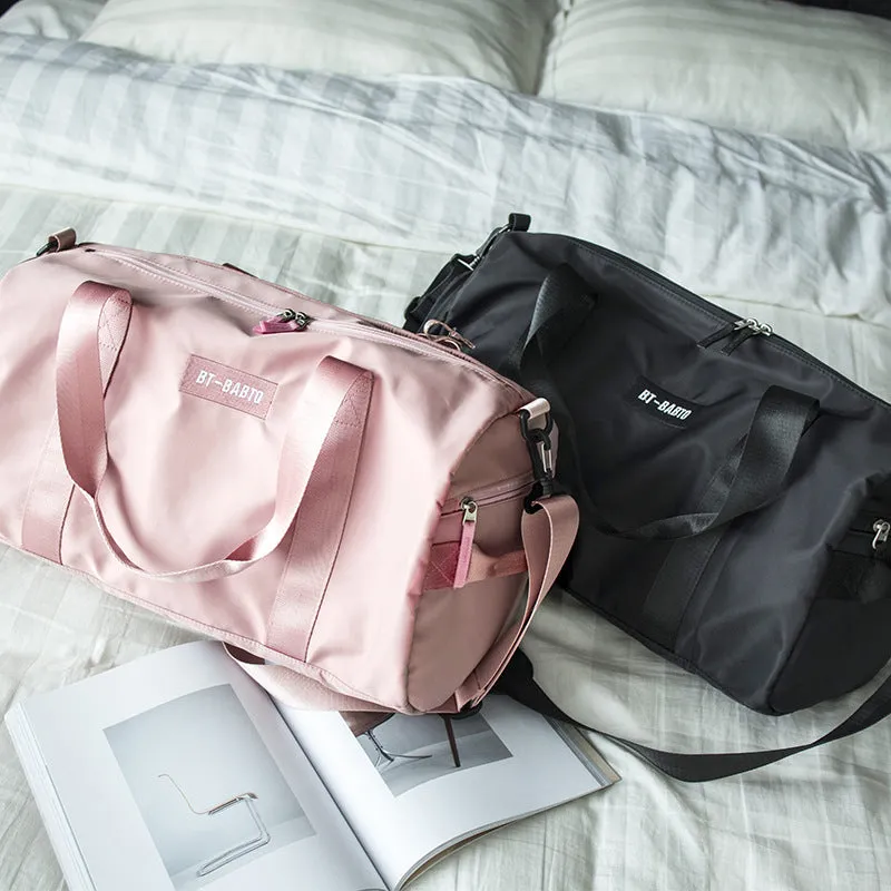 Beige casual sports bag with letter pattern design and contrast colour details.