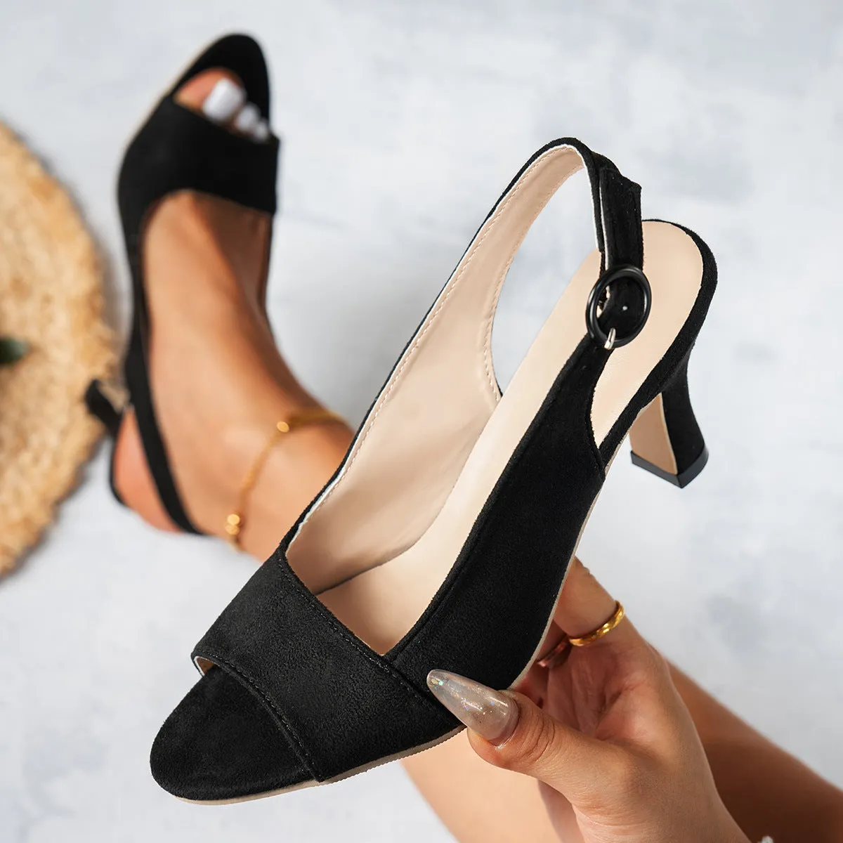 Women's pointed toe stiletto high heel shoes in black suede with buckle fastening