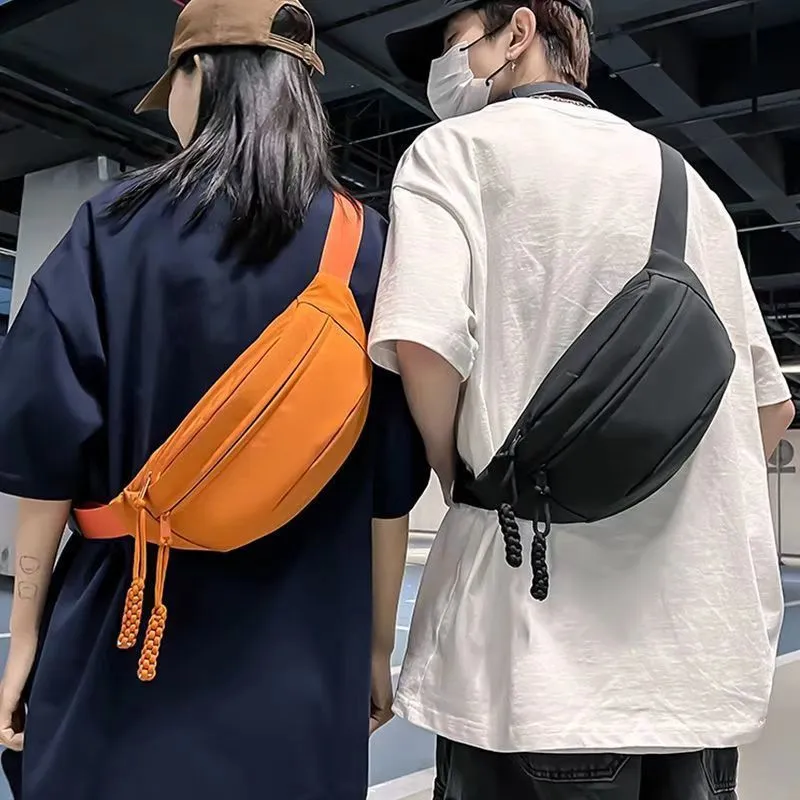 Men's black polyester chest bag shown as a crossbody bag with 35cm width