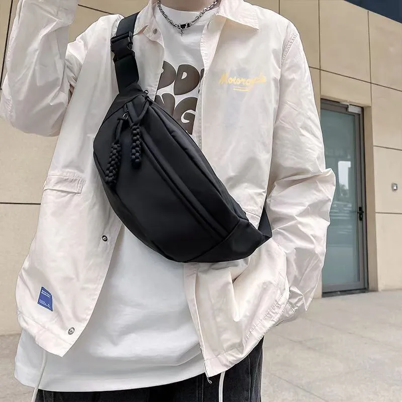 Men's black polyester chest bag shown as a crossbody bag with 35cm width