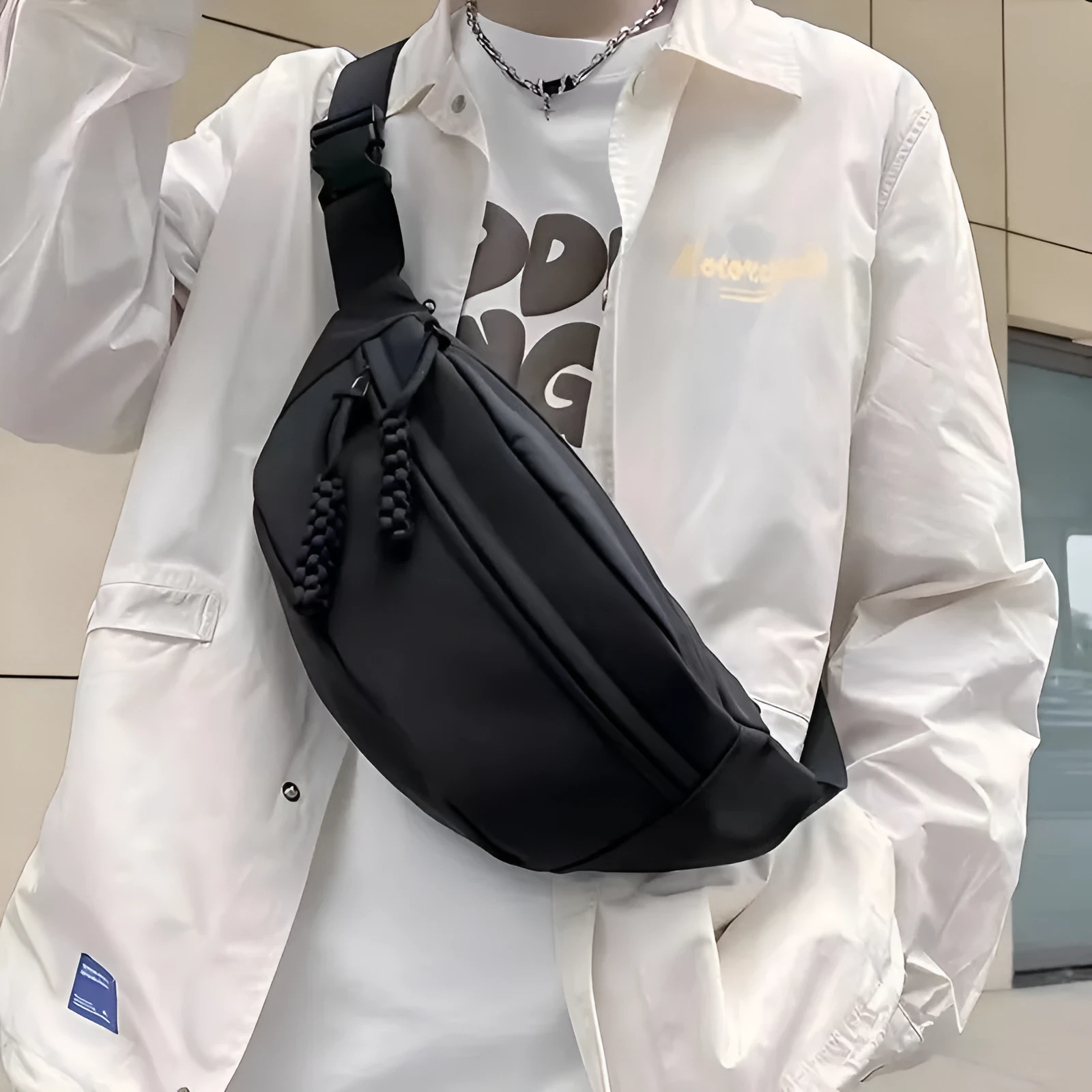 Men's black polyester chest bag shown as a crossbody bag with 35cm width