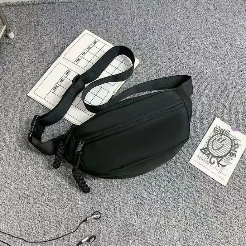 Men's black polyester chest bag shown as a crossbody bag with 35cm width