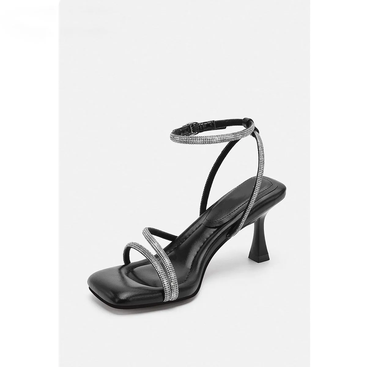 Women's silver rhinestone sandals with square toe and ankle strap buckle on a rubber sole.