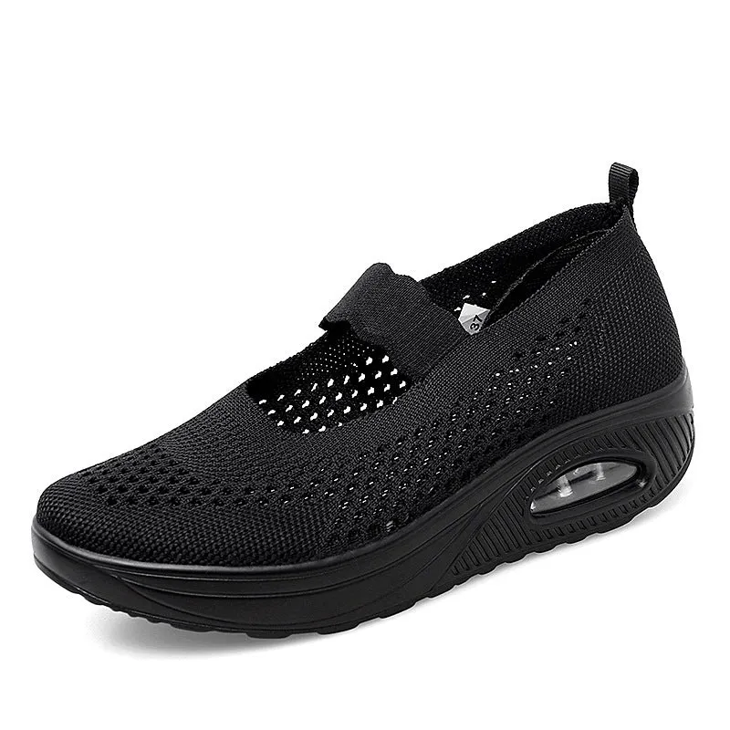 Women's beige slip-on mesh shoes with round toe and low heel on a white background
