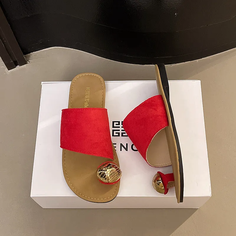 Women's flat bottomed French toe flip flops in solid colours on a light background