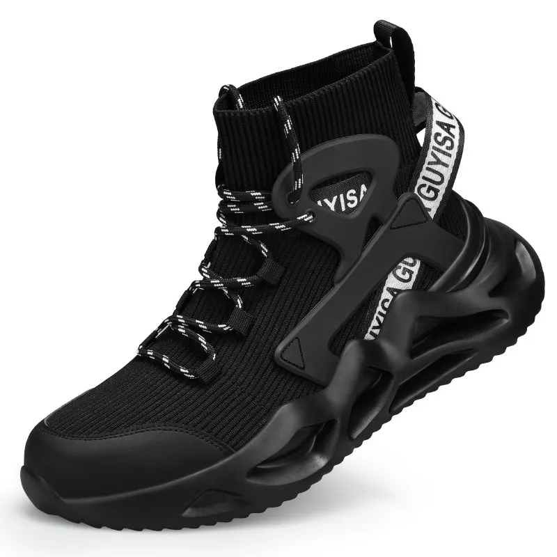 Men's black and white steel toe cap safety work shoes with fly woven mesh upper and rubber sole on concrete floor
