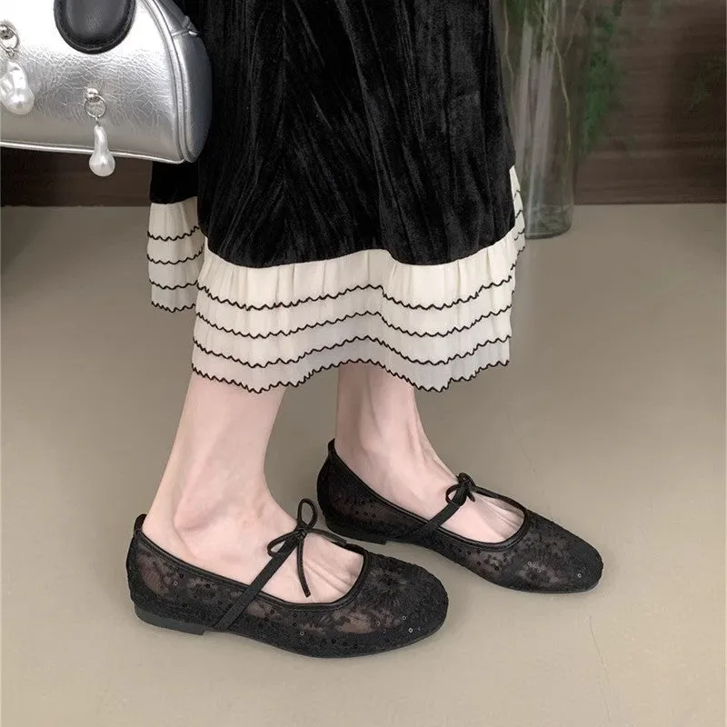 Women's pink flat lace mesh Mary Jane evening shoes with a mid heel on a white background.