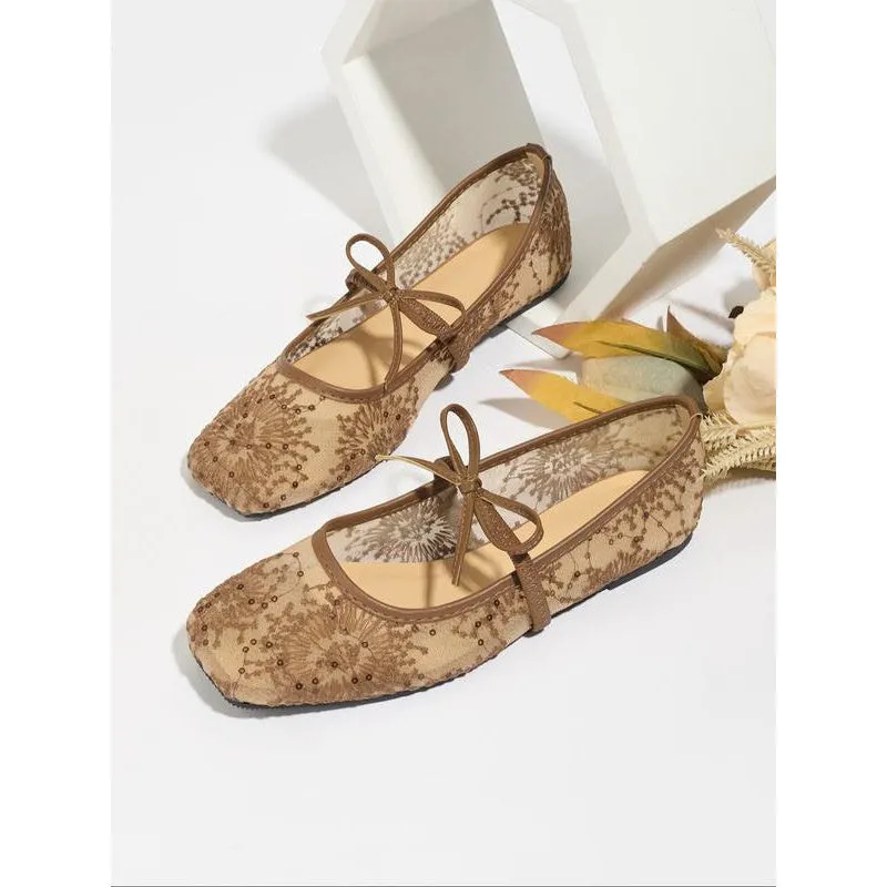 Women's pink flat lace mesh Mary Jane evening shoes with a mid heel on a white background.