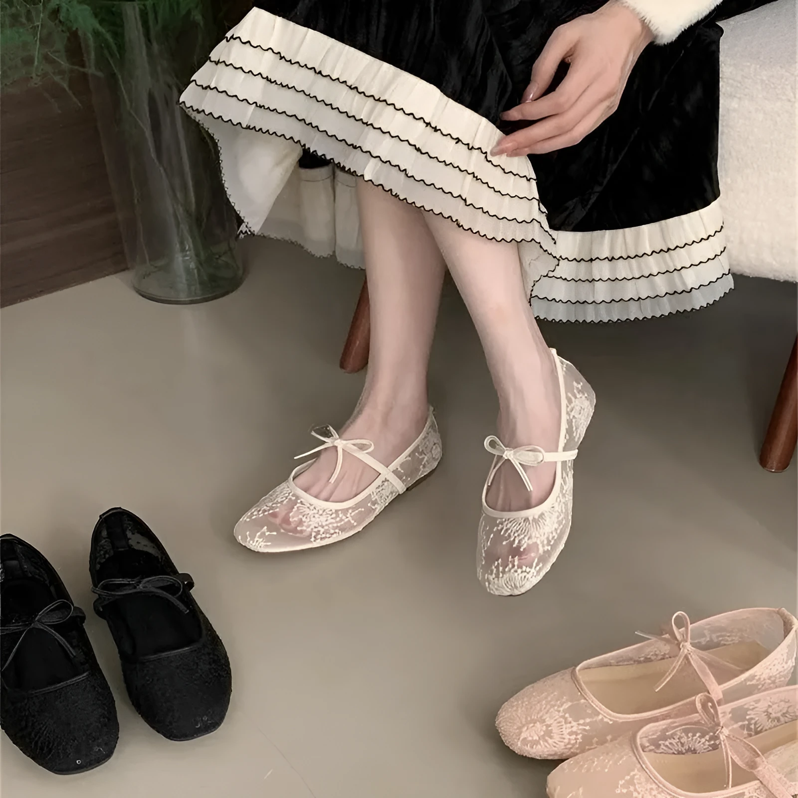Women's pink flat lace mesh Mary Jane evening shoes with a mid heel on a white background.