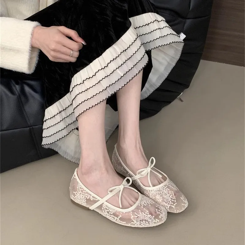 Women's pink flat lace mesh Mary Jane evening shoes with a mid heel on a white background.