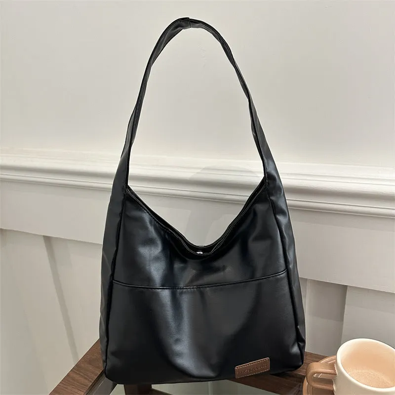 Women's retro large capacity PU bucket tote bag in Korean style with sewing thread detail, shown in coffee colour