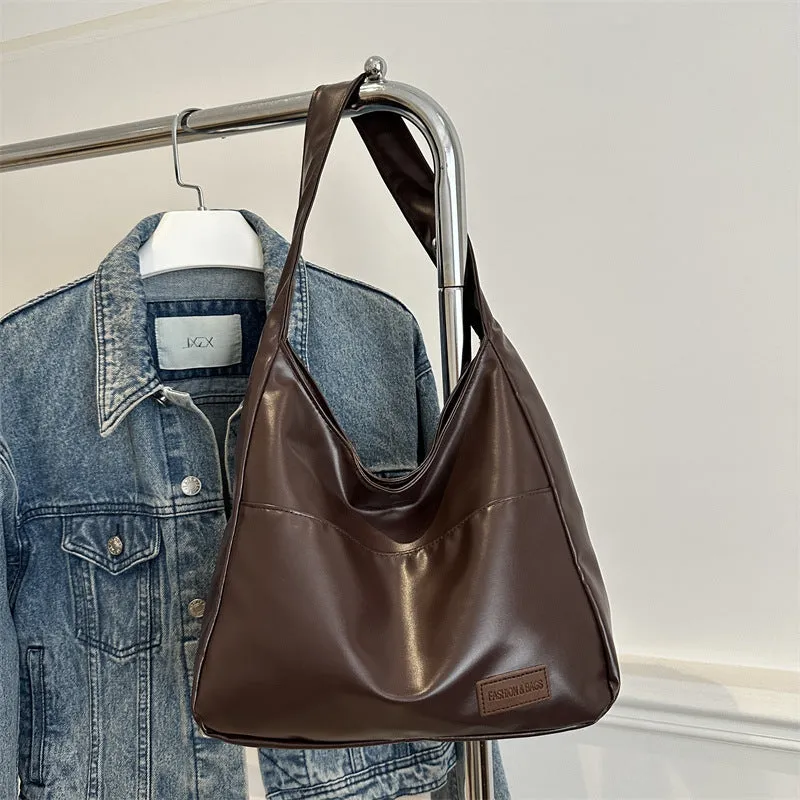 Women's retro large capacity PU bucket tote bag in Korean style with sewing thread detail, shown in coffee colour