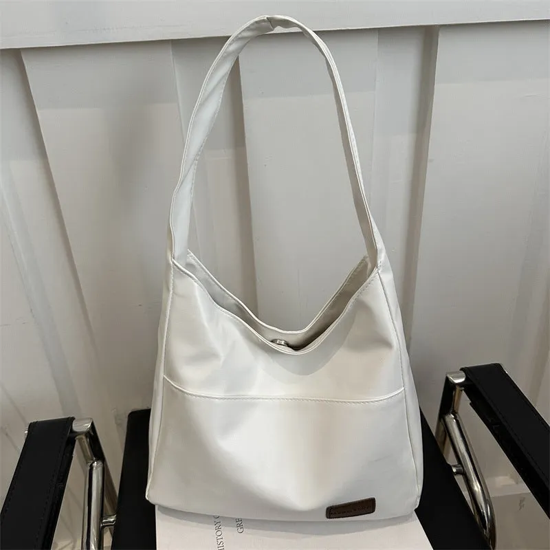 Women's retro large capacity PU bucket tote bag in Korean style with sewing thread detail, shown in coffee colour