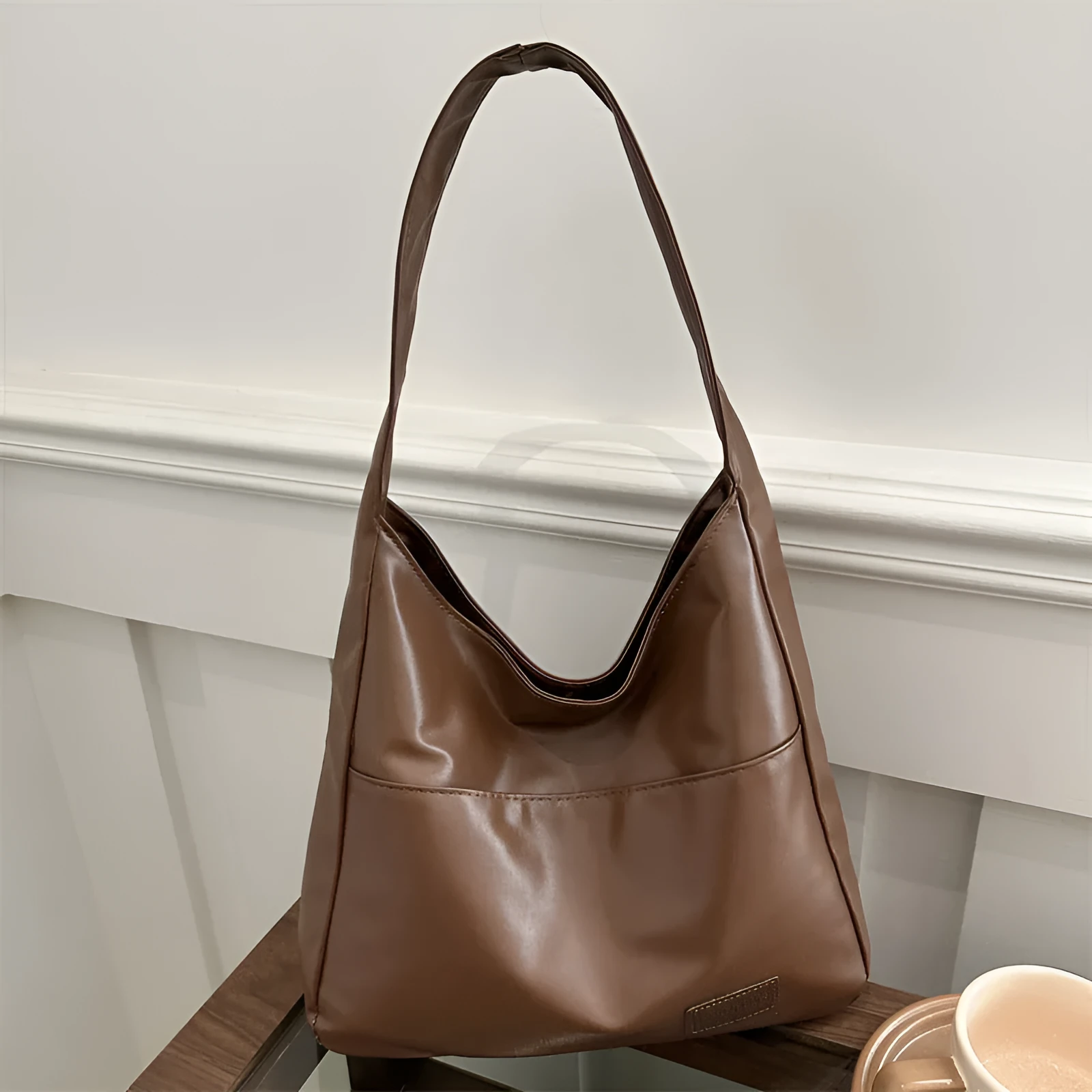 Women's retro large capacity PU bucket tote bag in Korean style with sewing thread detail, shown in coffee colour