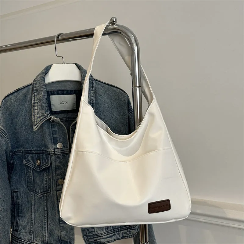 Women's retro large capacity PU bucket tote bag in Korean style with sewing thread detail, shown in coffee colour