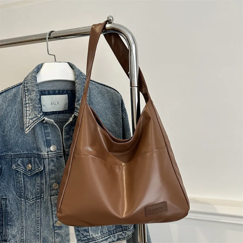 Women's retro large capacity PU bucket tote bag in Korean style with sewing thread detail, shown in coffee colour