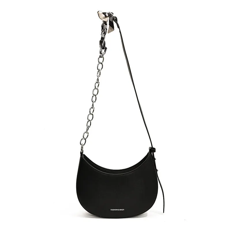 Small PU leather saddle bag on a flat surface, available in black, brown, coffee, green, khaki, and white