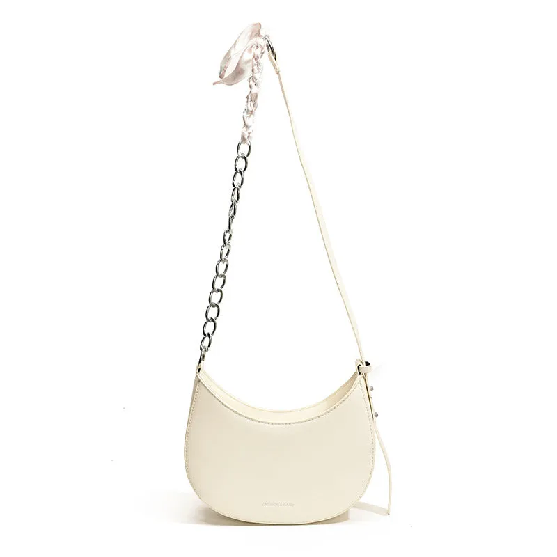 Small PU leather saddle bag on a flat surface, available in black, brown, coffee, green, khaki, and white