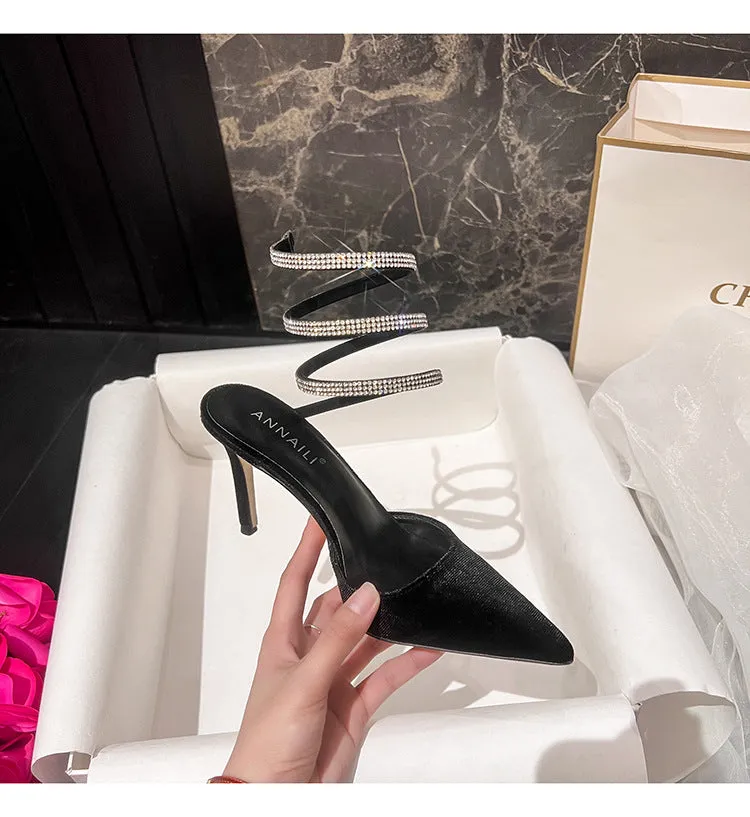 Women's pointed stiletto heel high heels in black velvet with ankle strap cross tie closure