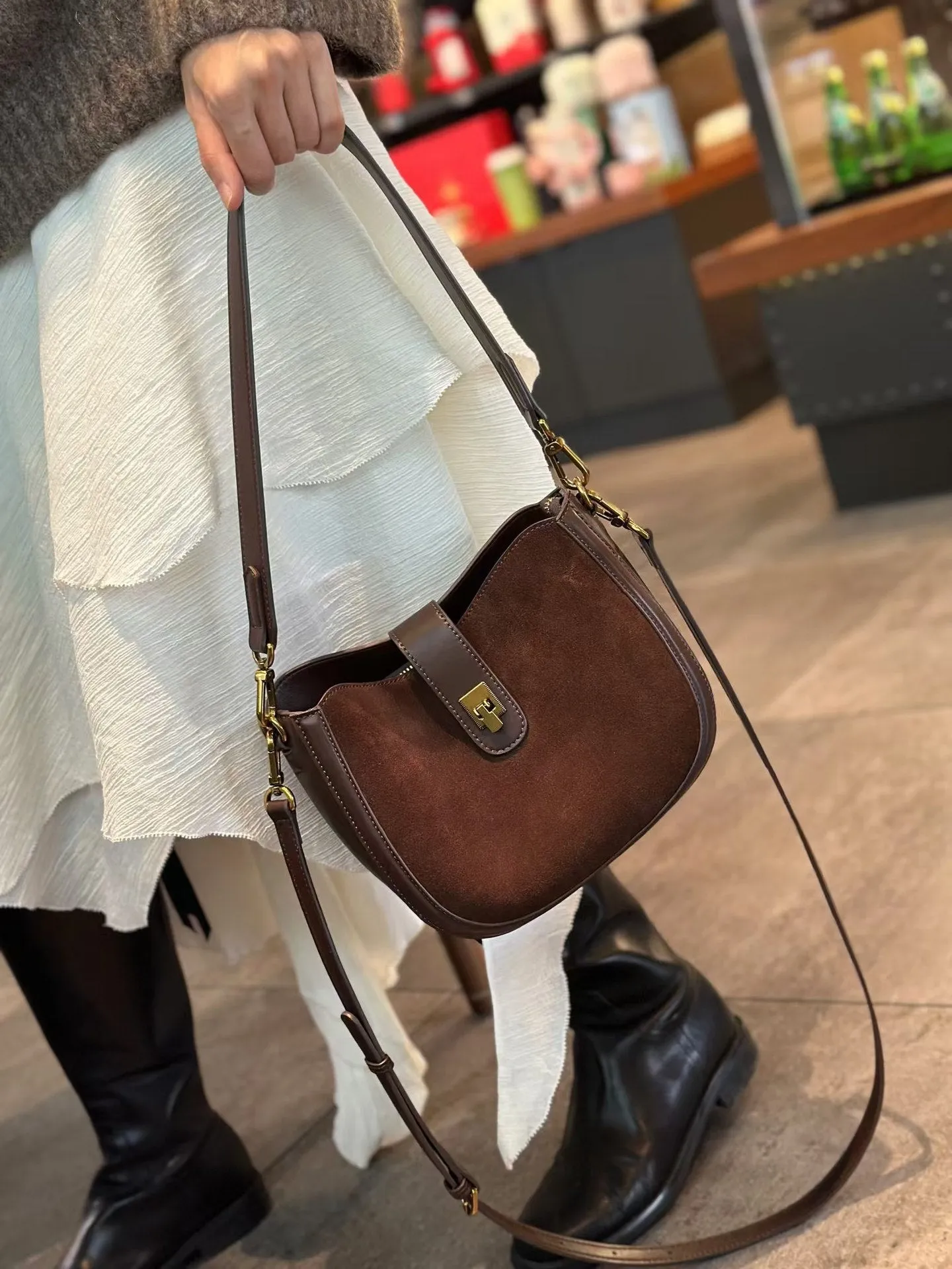 Women's brown genuine leather one-shoulder crossbody bag with a front sandwich pocket