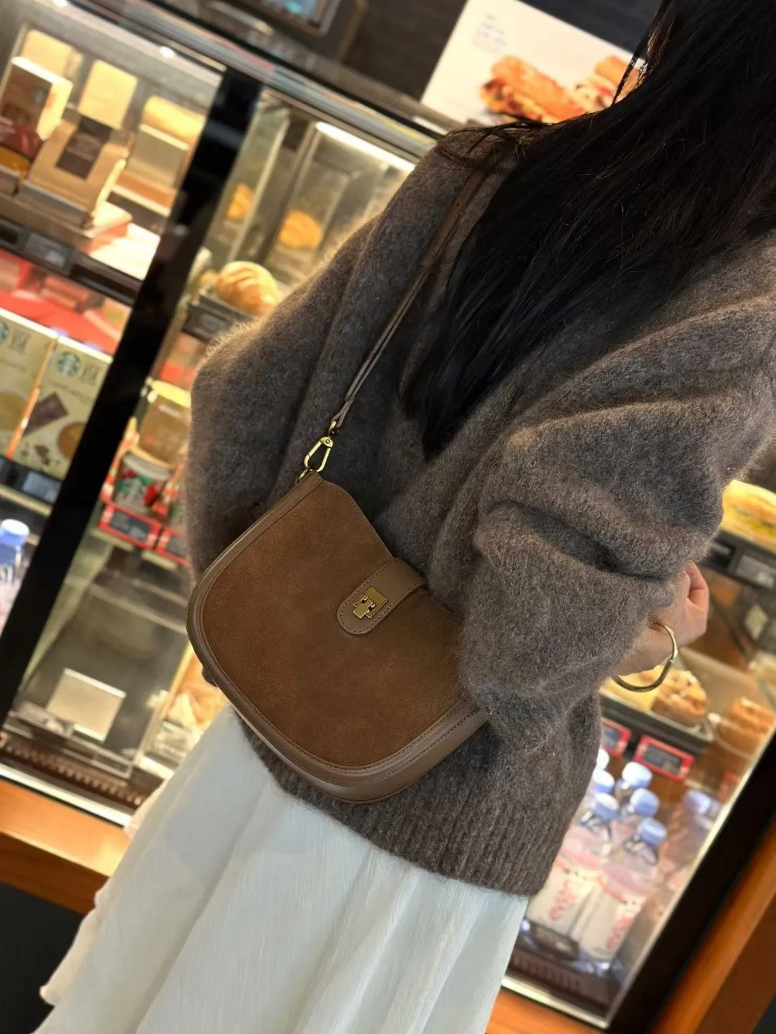 Women's brown genuine leather one-shoulder crossbody bag with a front sandwich pocket