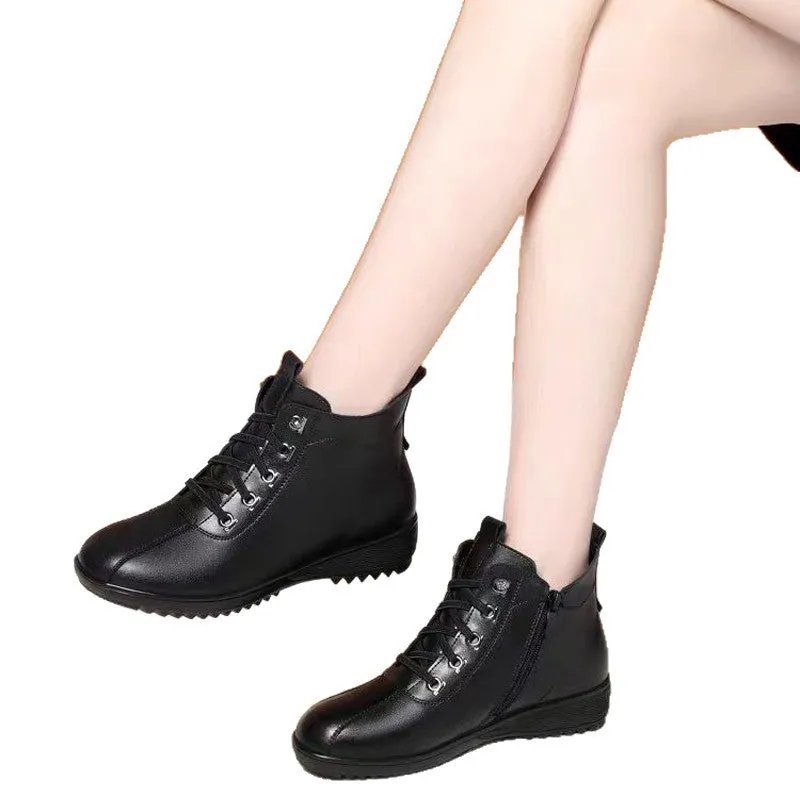 Women's casual shoes in black artificial PU with mid heel, side zipper, and round toe on light background