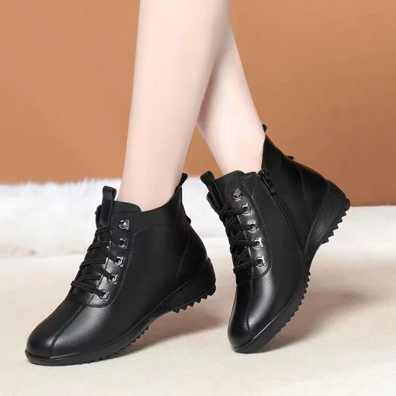 Women's casual shoes in black artificial PU with mid heel, side zipper, and round toe on light background