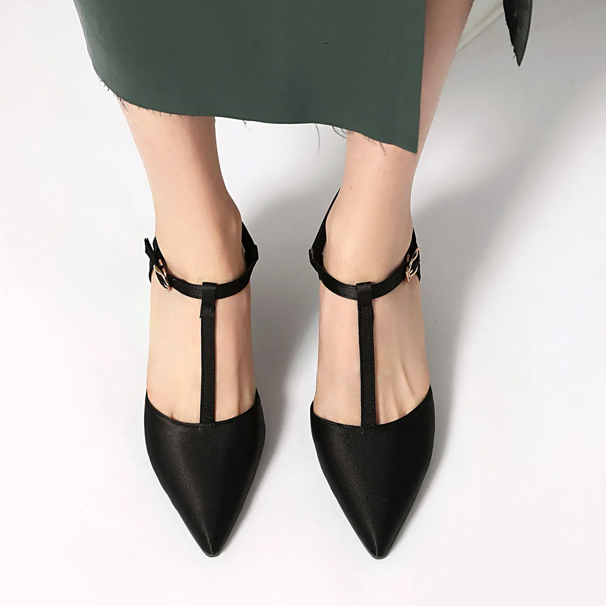 Pointed T-strap high heels in top grain leather, available in black and brown