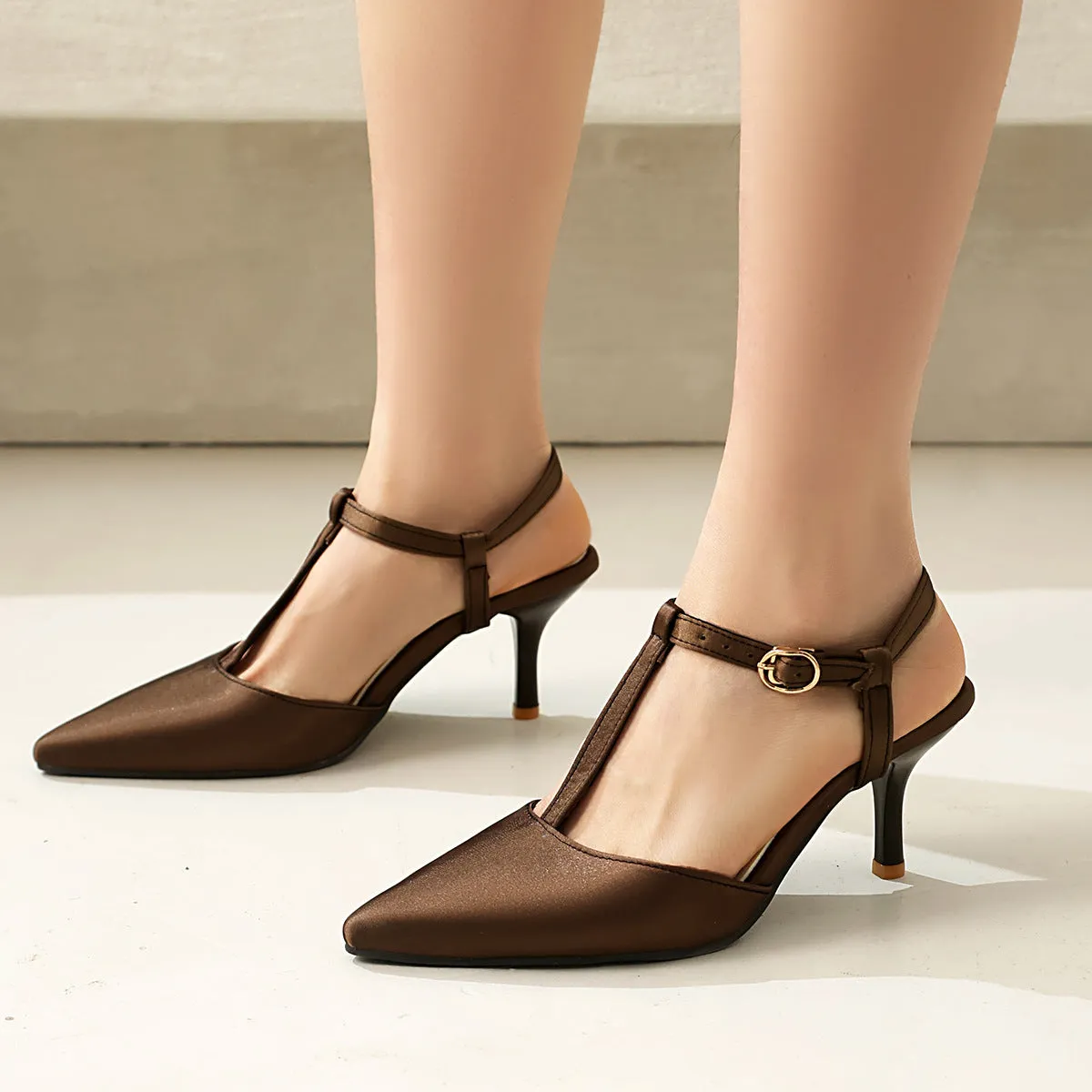 Pointed T-strap high heels in top grain leather, available in black and brown