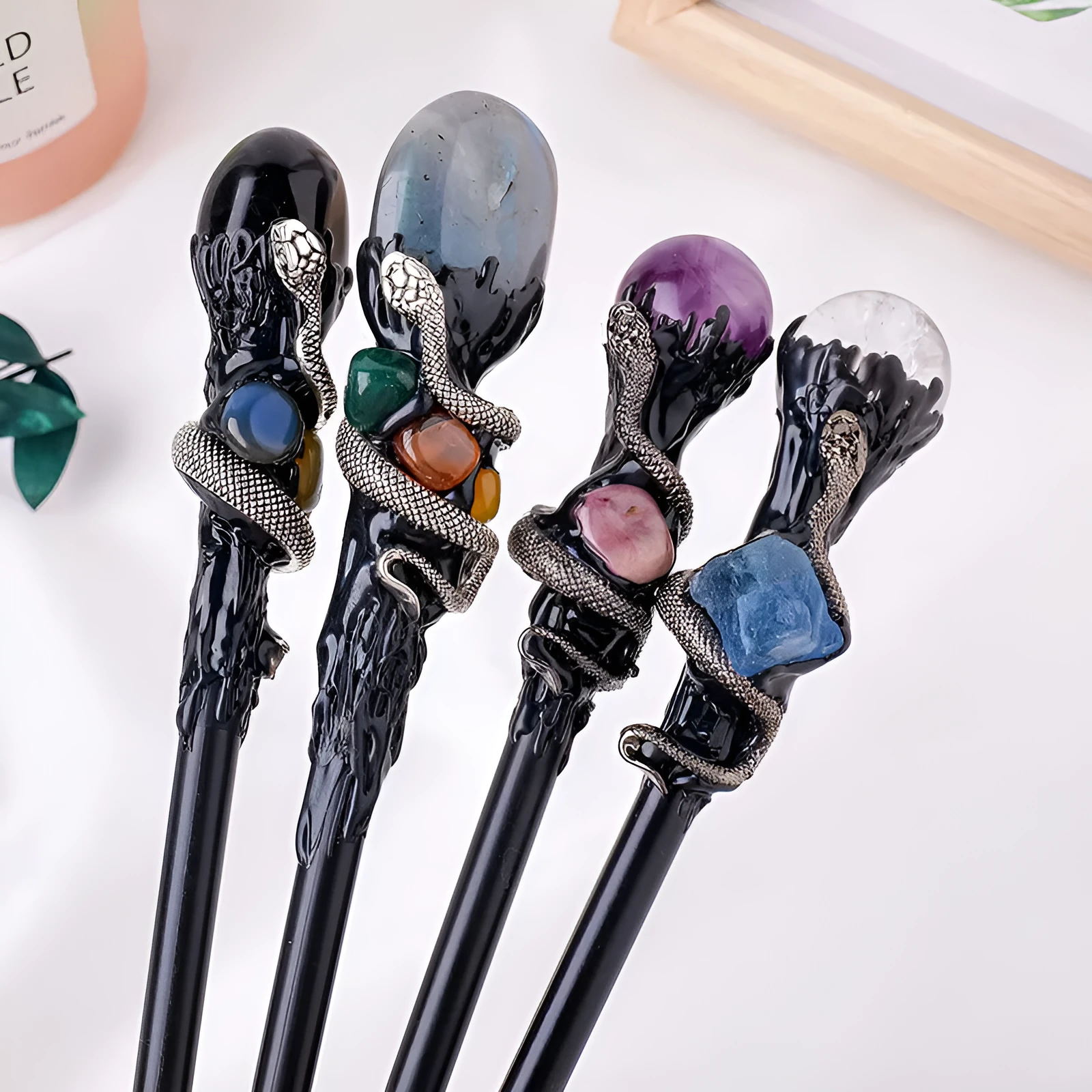 Natural crystal ball truncheon magic wand with amethyst stone ball on dark background