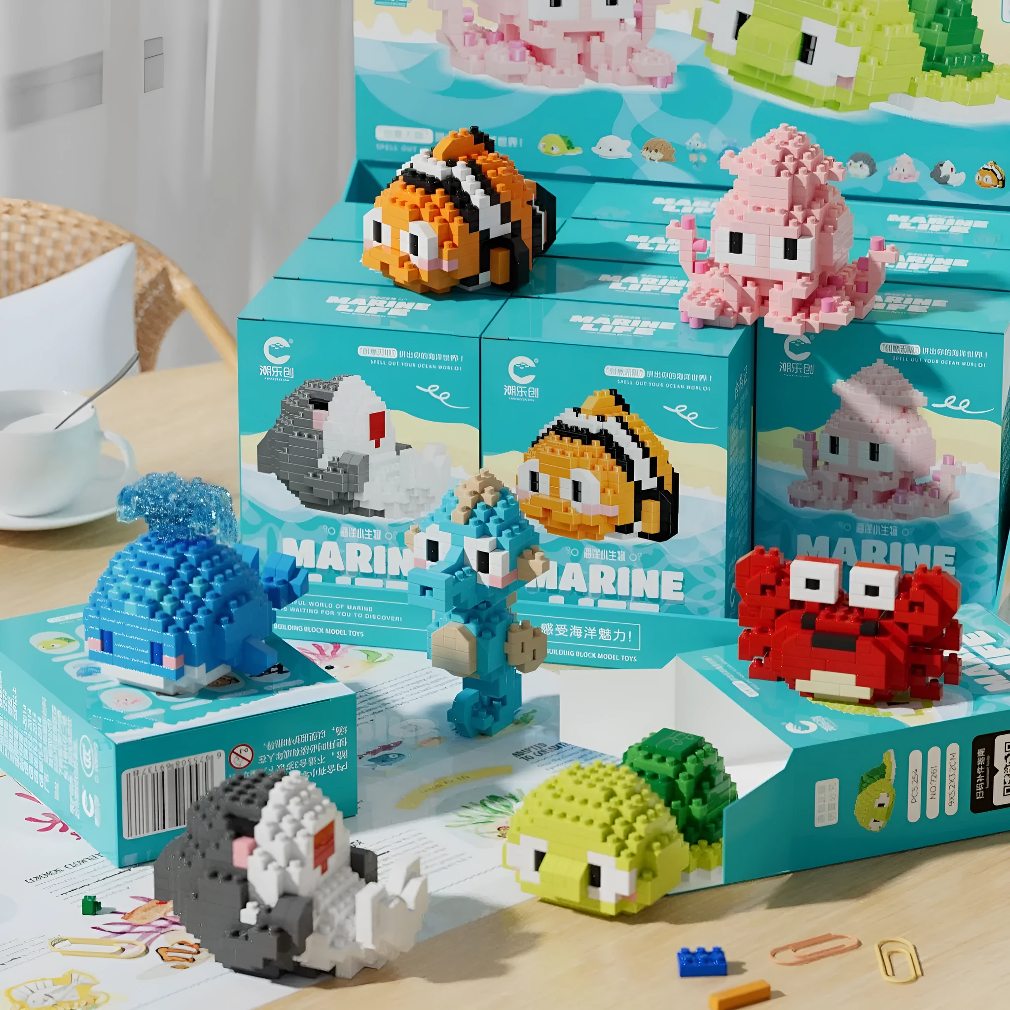 Twelve marine small creature building block models in a colour box including turtle, blue whale, and clownfish.